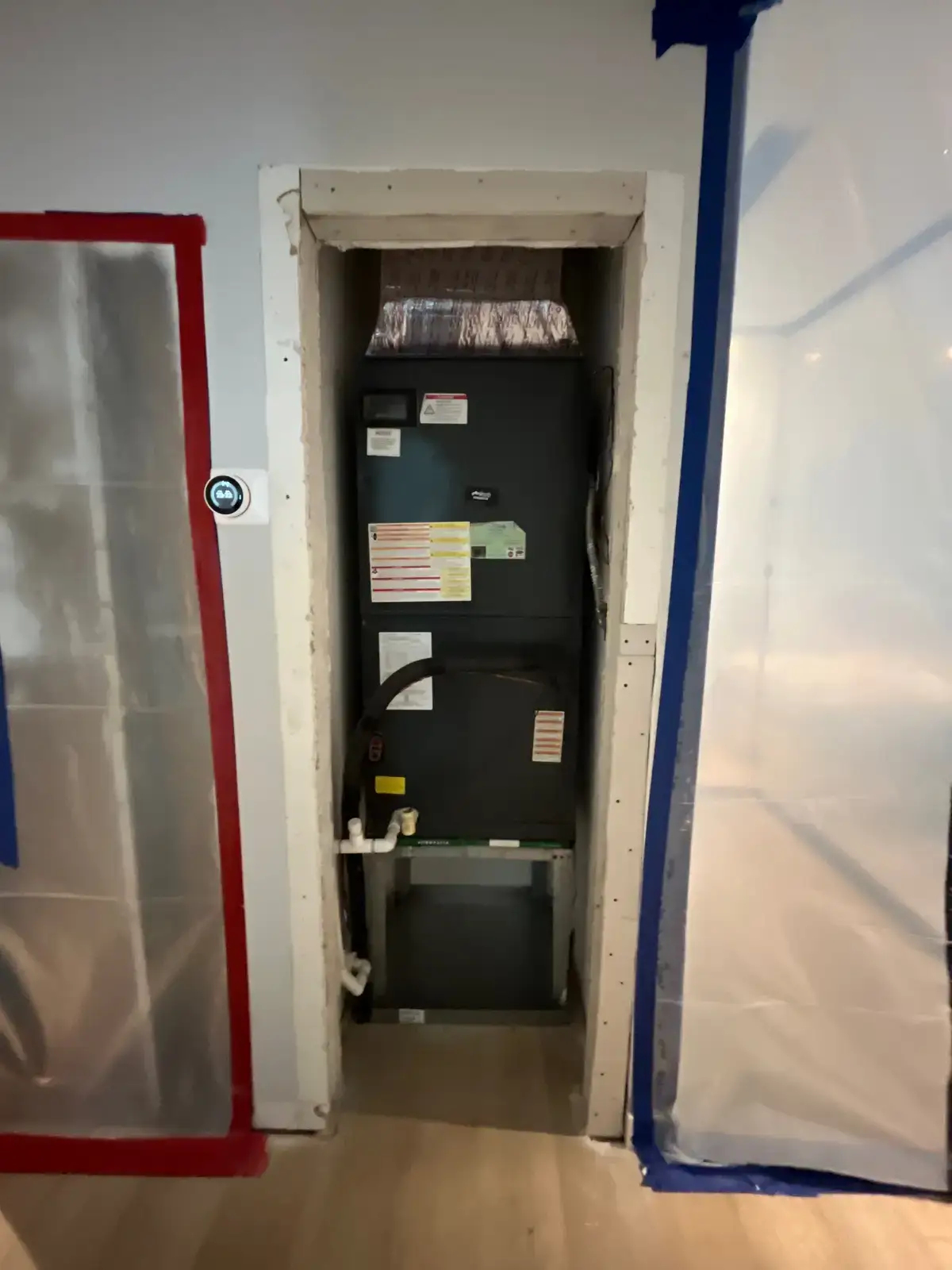 Containment barrier around an AC area during mold remediation.