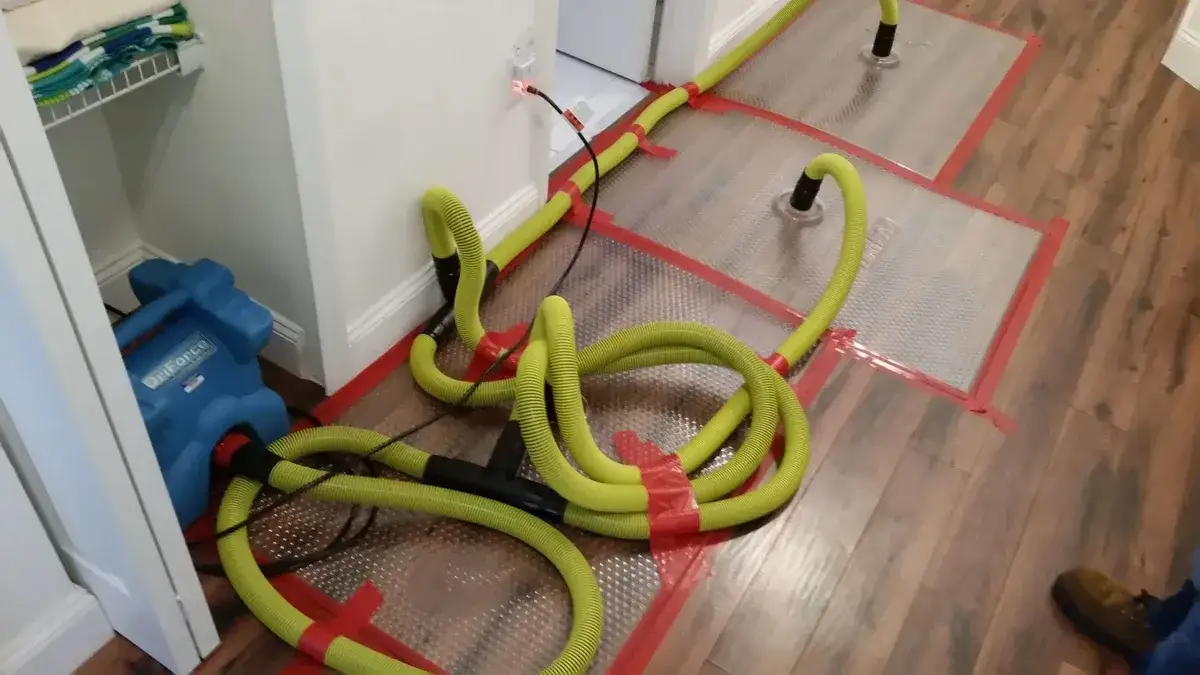 Professional drying equipment staged across wet flooring during a structural dry-out.