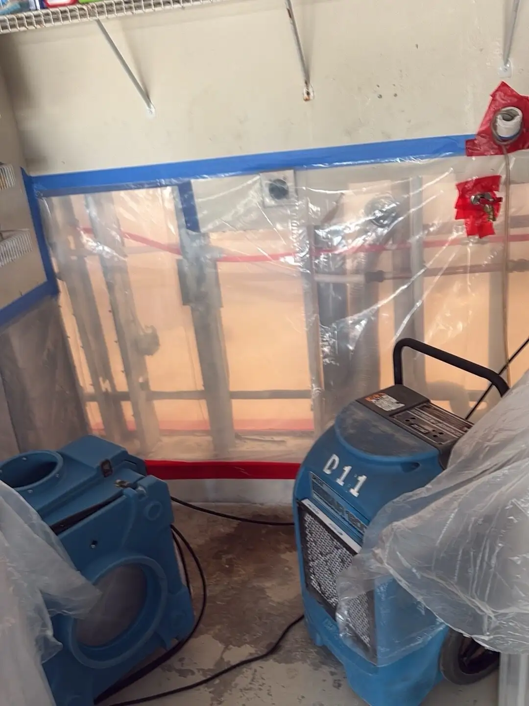 Containment and drying equipment after wall opening in Miramar.