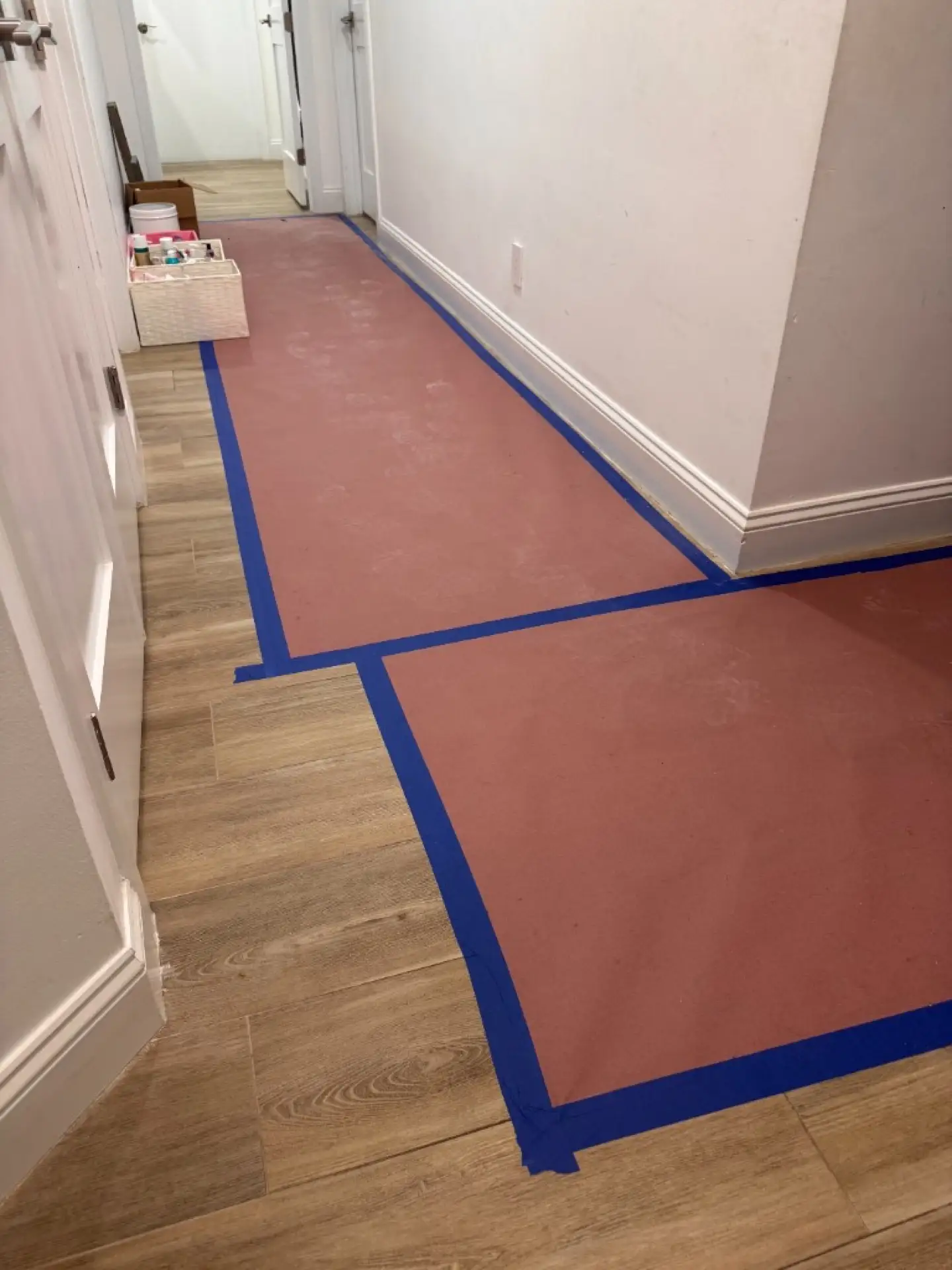 Interior walkway protection taped along a Davie hallway to keep dust and debris off existing floors