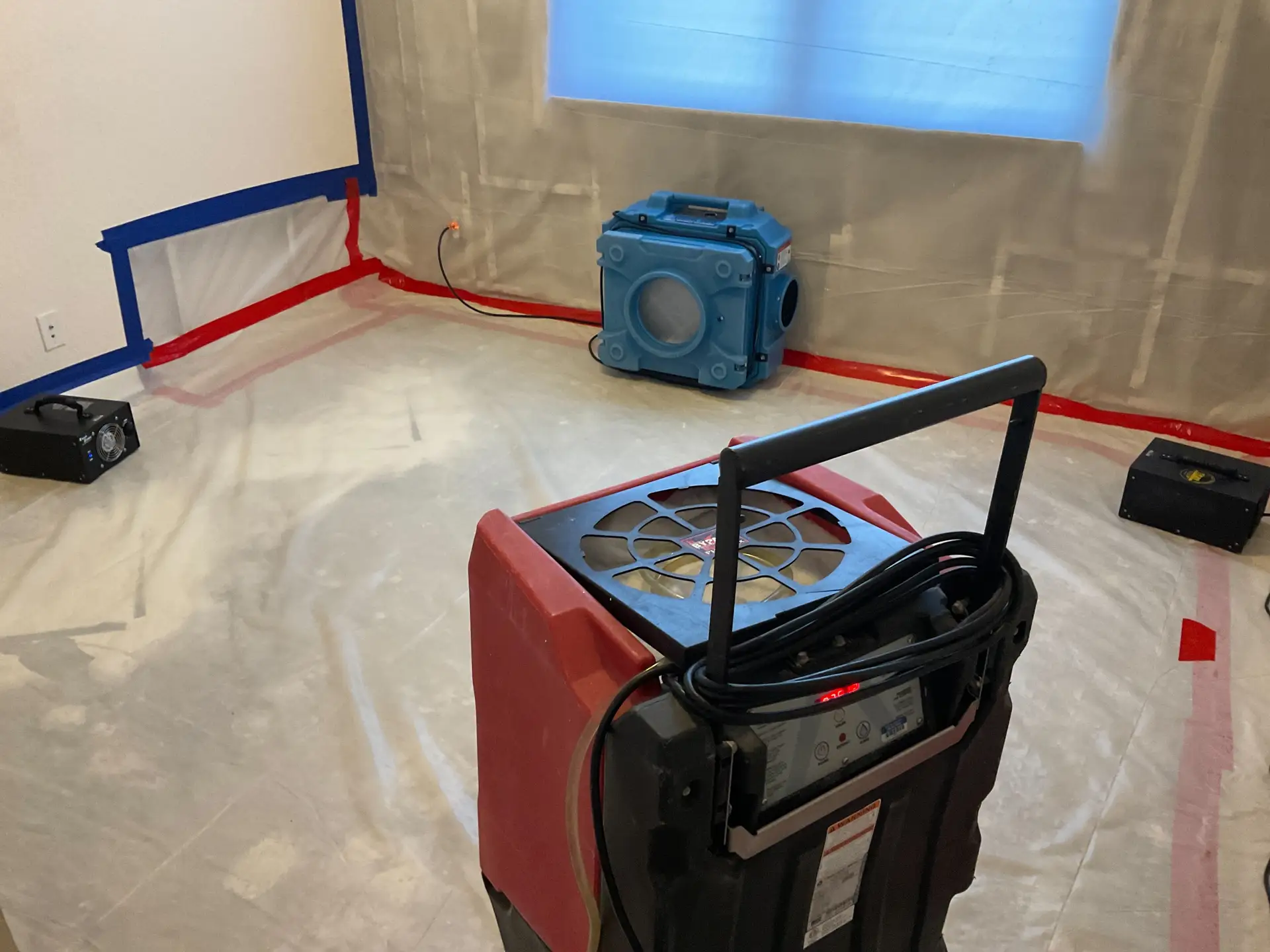 Dehumidifier and HEPA air scrubber used for moisture control
